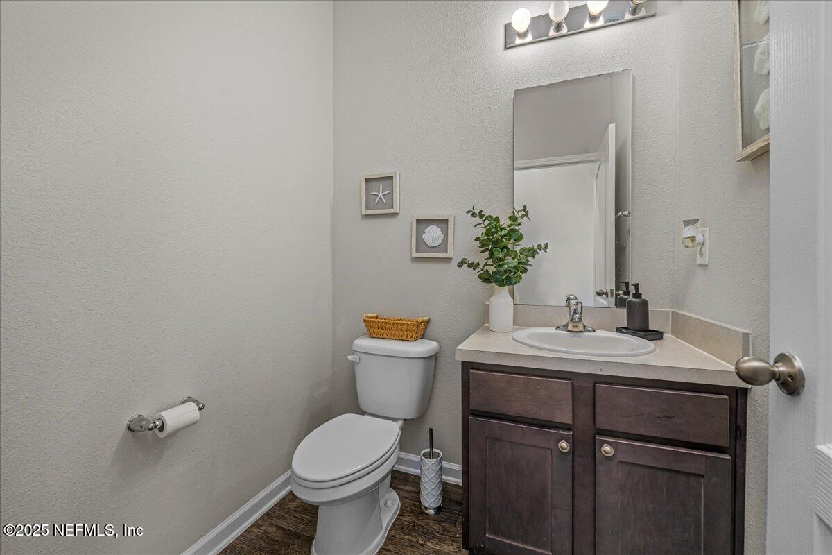 3557 Grayson Lane Middleburg, FL 32068 - Photo 12 of 18 a bathroom with a sink toilet and a mirror