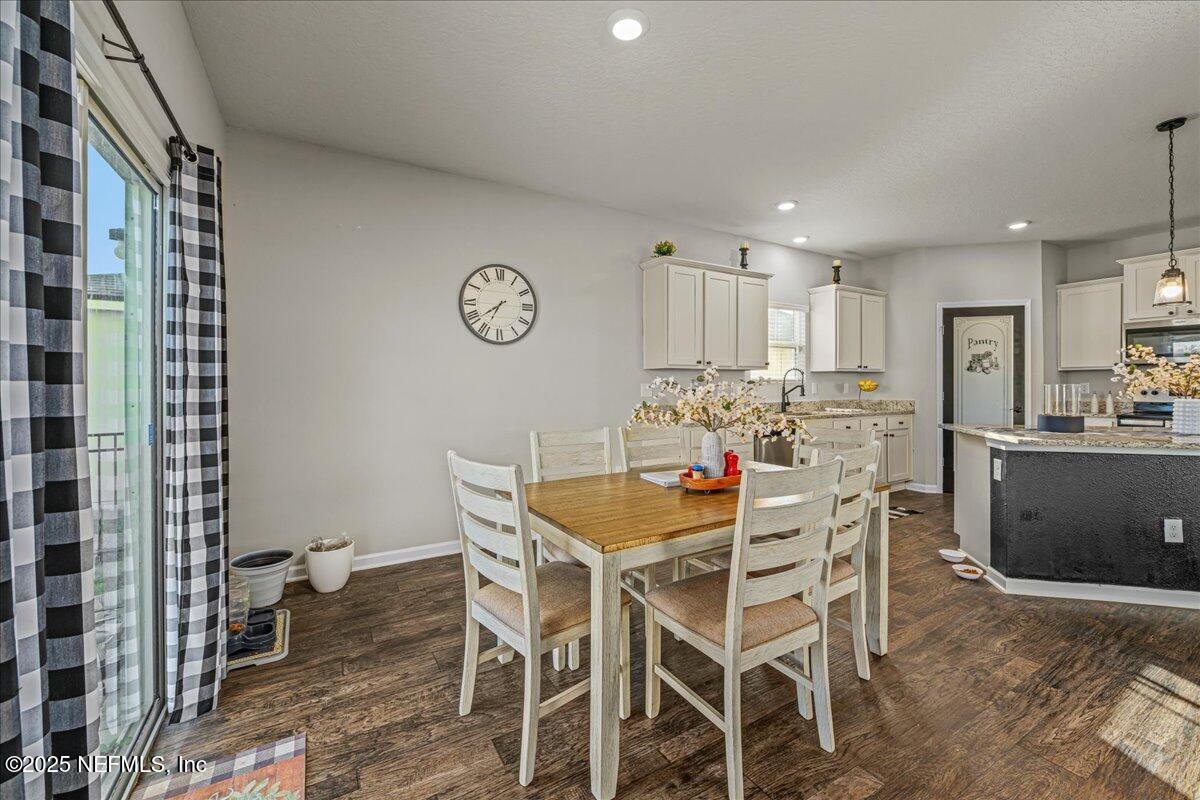 3557 Grayson Lane Middleburg, FL 32068 - Photo 5 of 18 a view of a dining room with furniture and wooden floor