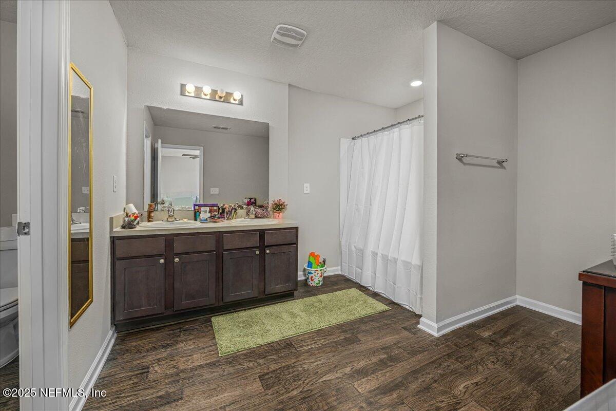 3557 Grayson Lane Middleburg, FL 32068 - Photo 8 of 18 a bathroom with a sink and a mirror
