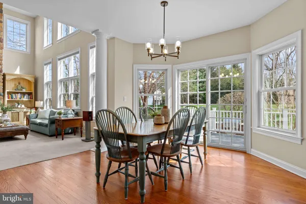 a kitchen with center island cabinets and wooden floor