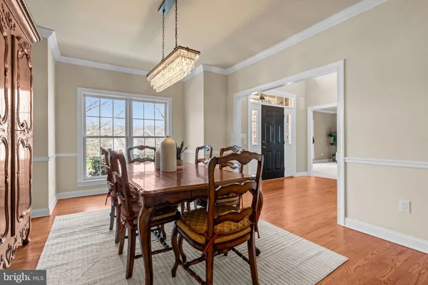 a spacious bedroom with a bed a table and a window