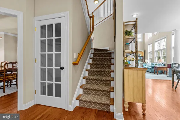 a view of a room with a table and chairs