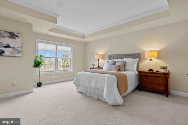 a bathroom with a tub sink and a mirror