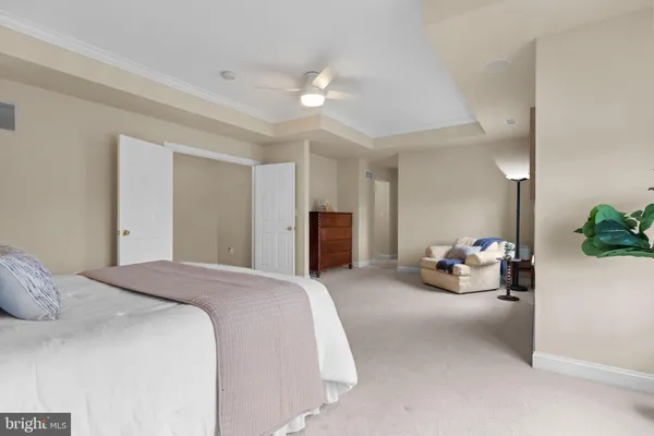 a spacious bathroom with a double vanity sink and a mirror