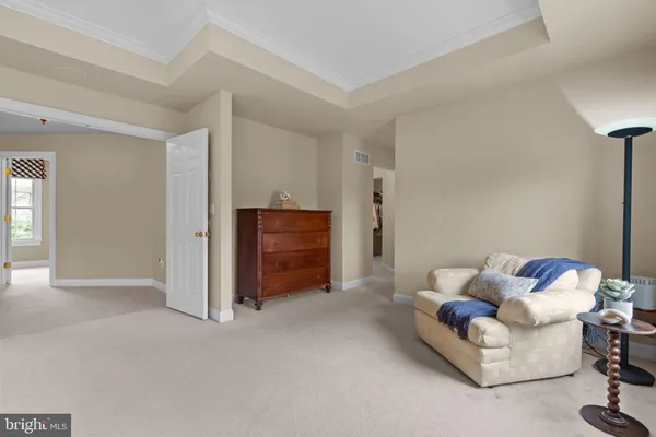 a spacious bathroom with a double vanity sink a mirror and a bathtub