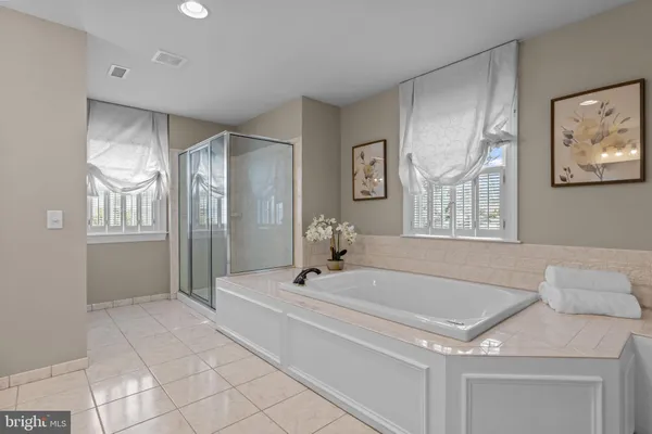 a view of a hallway with windows and stairs