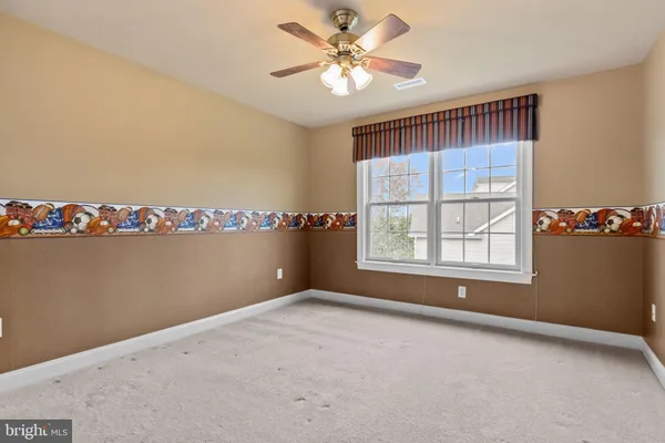 a view of a chairs and table under an umbrella