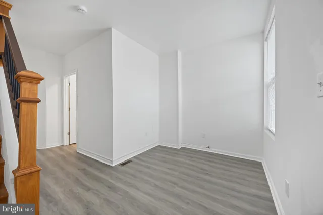 a view of an entryway with wooden floor