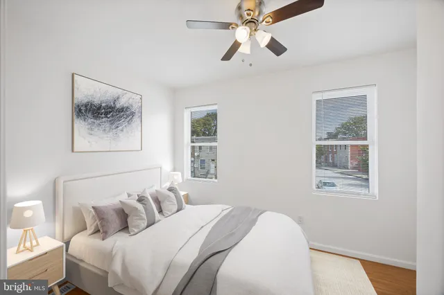 a bedroom with a large bed and a window