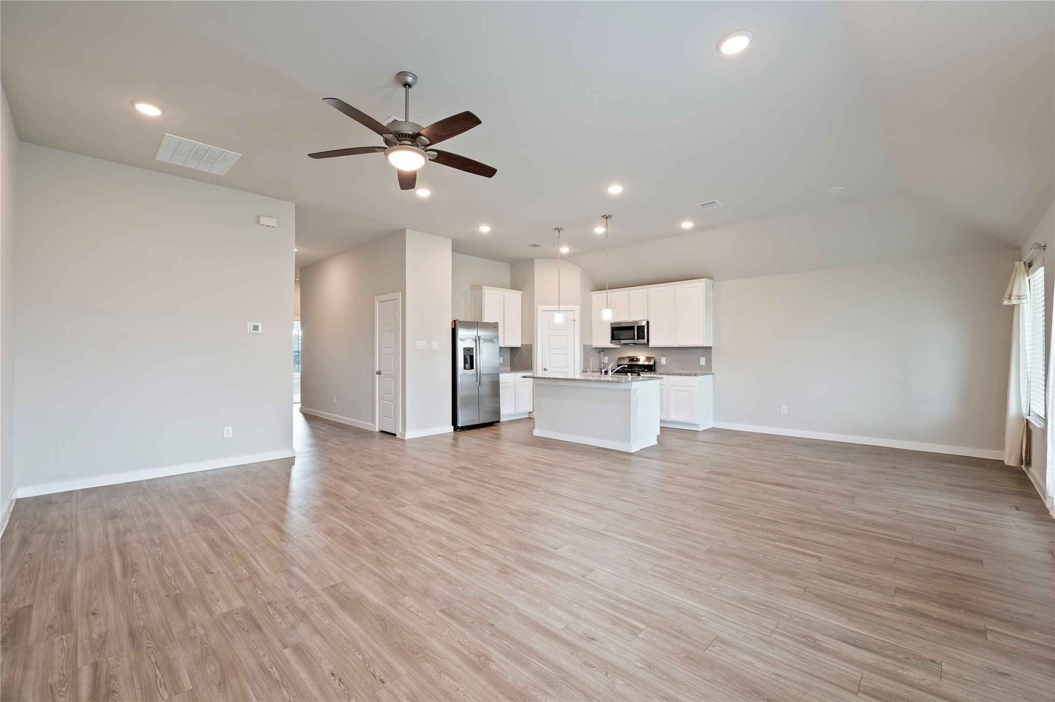 2107 Santa Ana Way Baytown, TX 77523 - Photo 11 of 40 a view of a kitchen with a sink and wooden floor