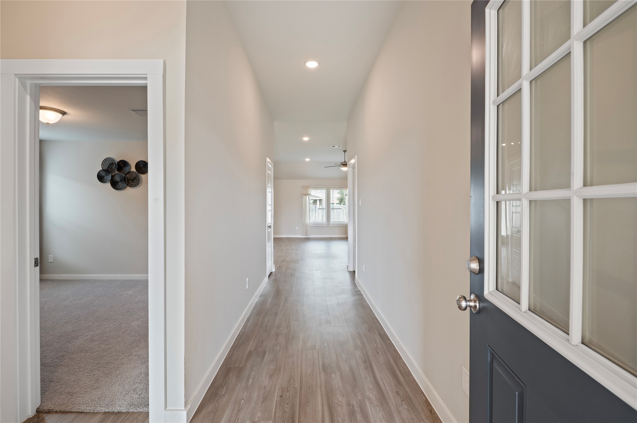 2107 Santa Ana Way Baytown, TX 77523 - Photo 13 of 40 a view of a hallway with wooden floor