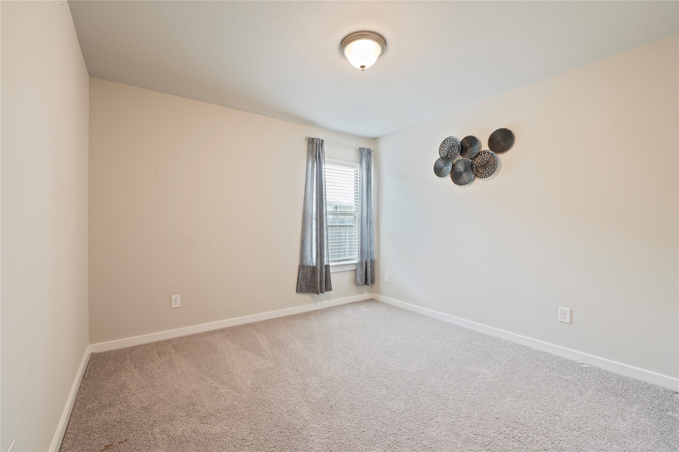 2107 Santa Ana Way Baytown, TX 77523 - Photo 17 of 40 an empty room with a window