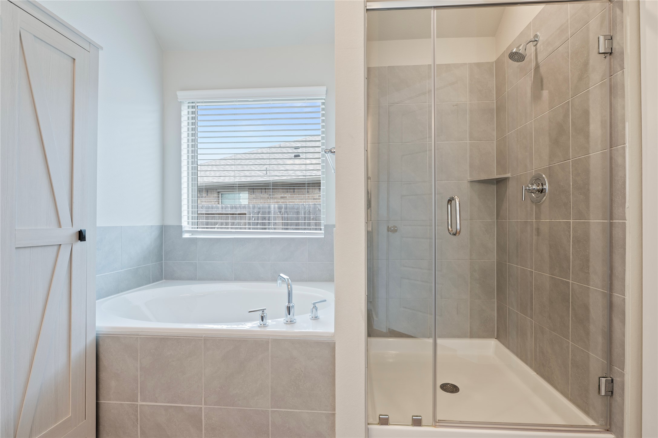 2107 Santa Ana Way Baytown, TX 77523 - Photo 22 of 40 a bathroom with a tub shower vanity and a sink