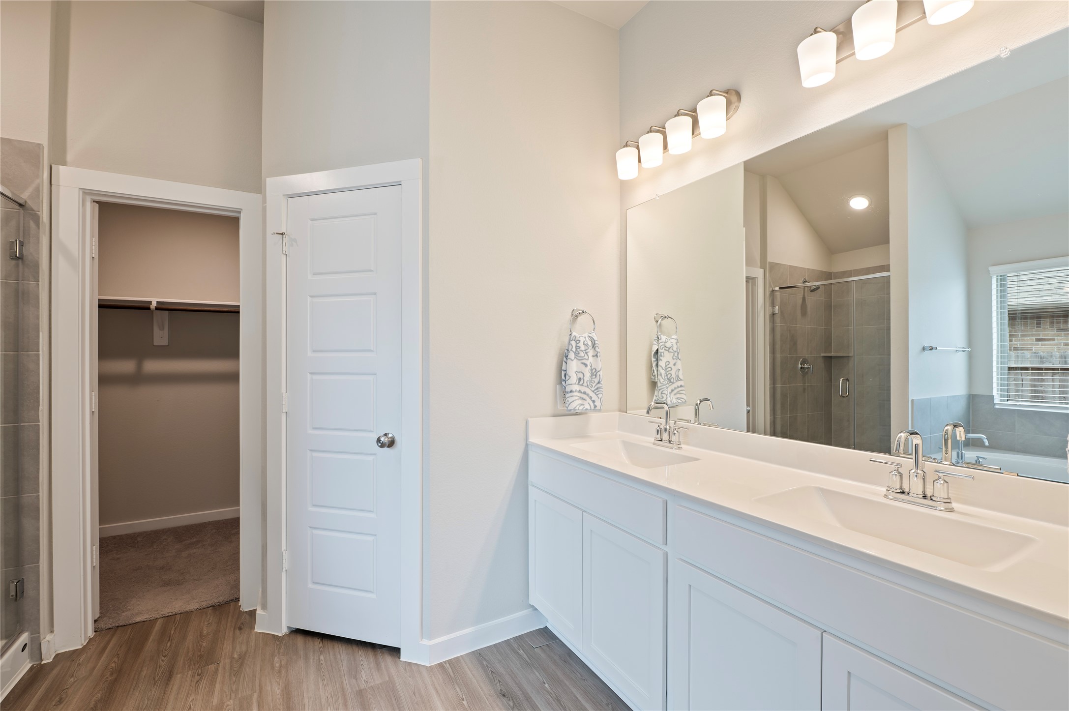 2107 Santa Ana Way Baytown, TX 77523 - Photo 24 of 40 a bathroom with a double vanity sink mirror and shower