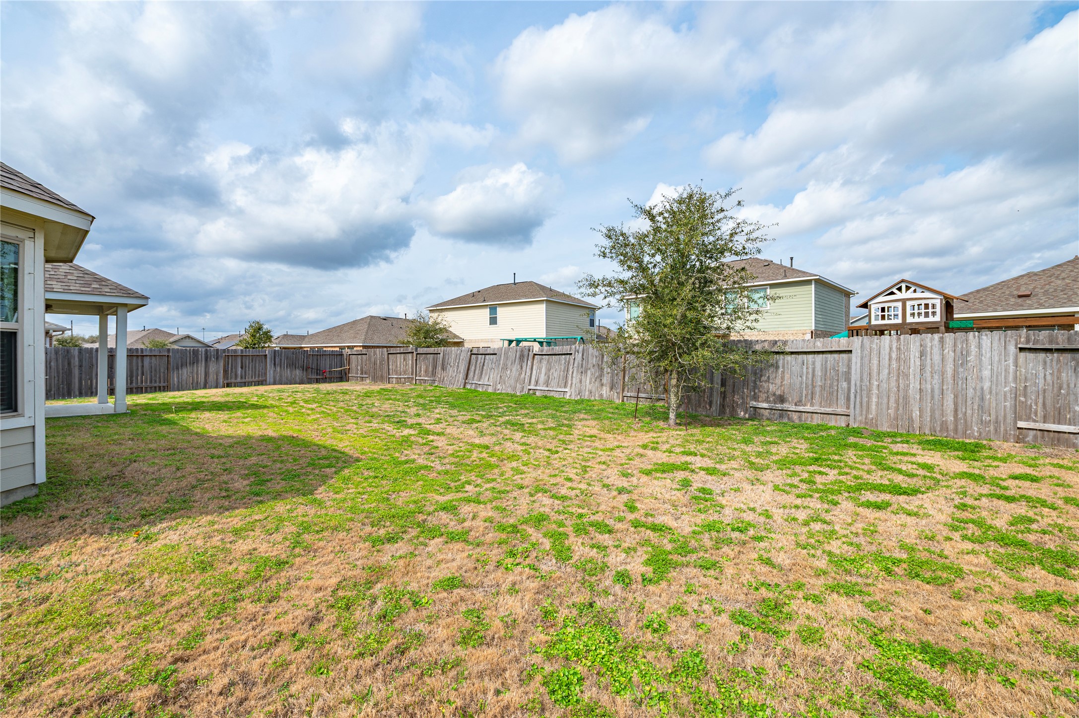 2107 Santa Ana Way Baytown, TX 77523 - Photo 28 of 40 a view of a house with backyard and a garden