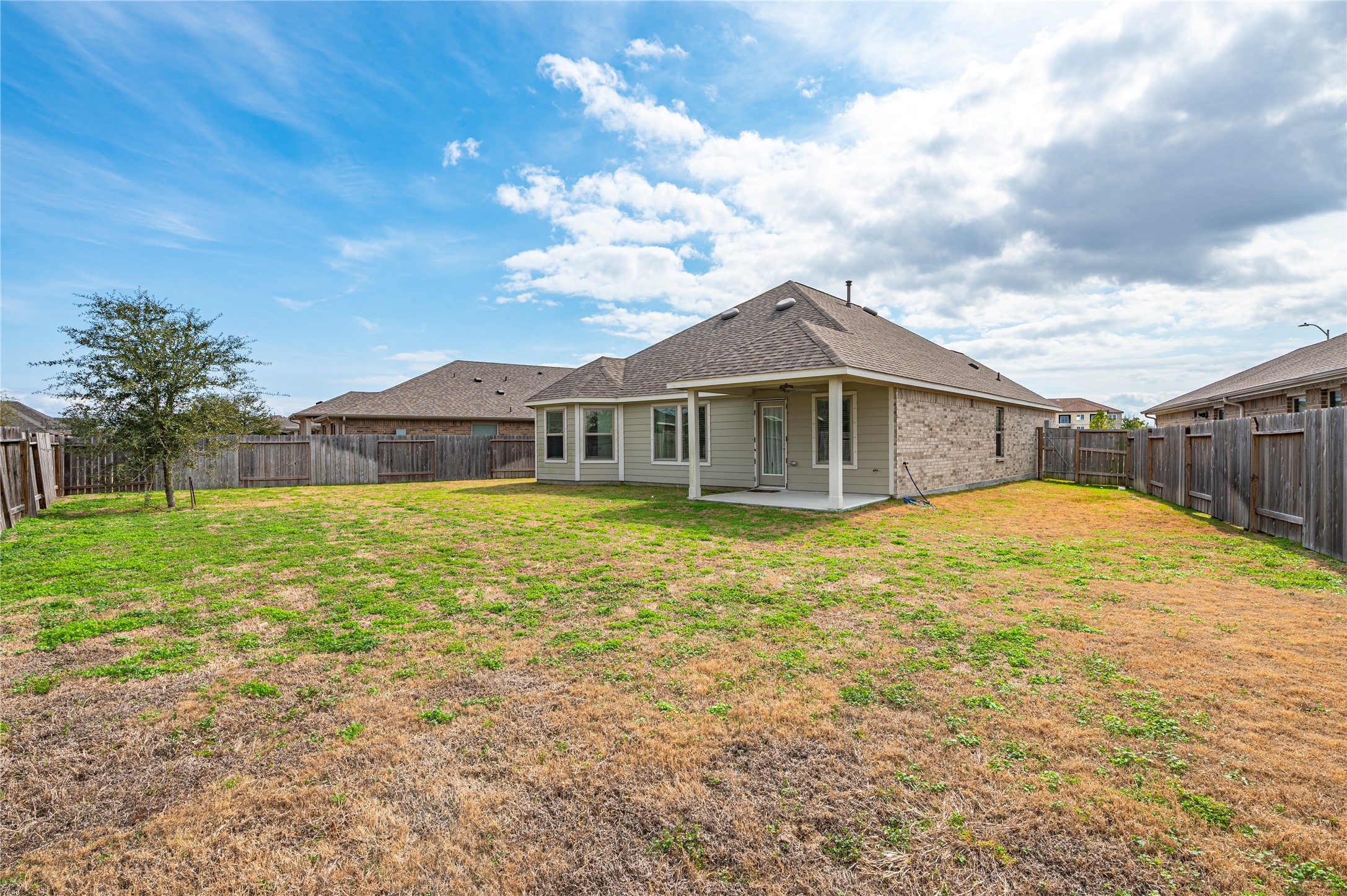 2107 Santa Ana Way Baytown, TX 77523 - Photo 30 of 40 a view of a house with a backyard