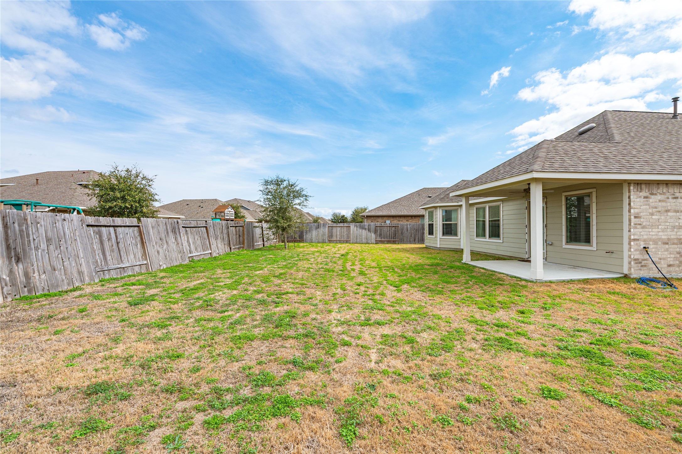 2107 Santa Ana Way Baytown, TX 77523 - Photo 31 of 40 a view of a house with backyard and wooden fence