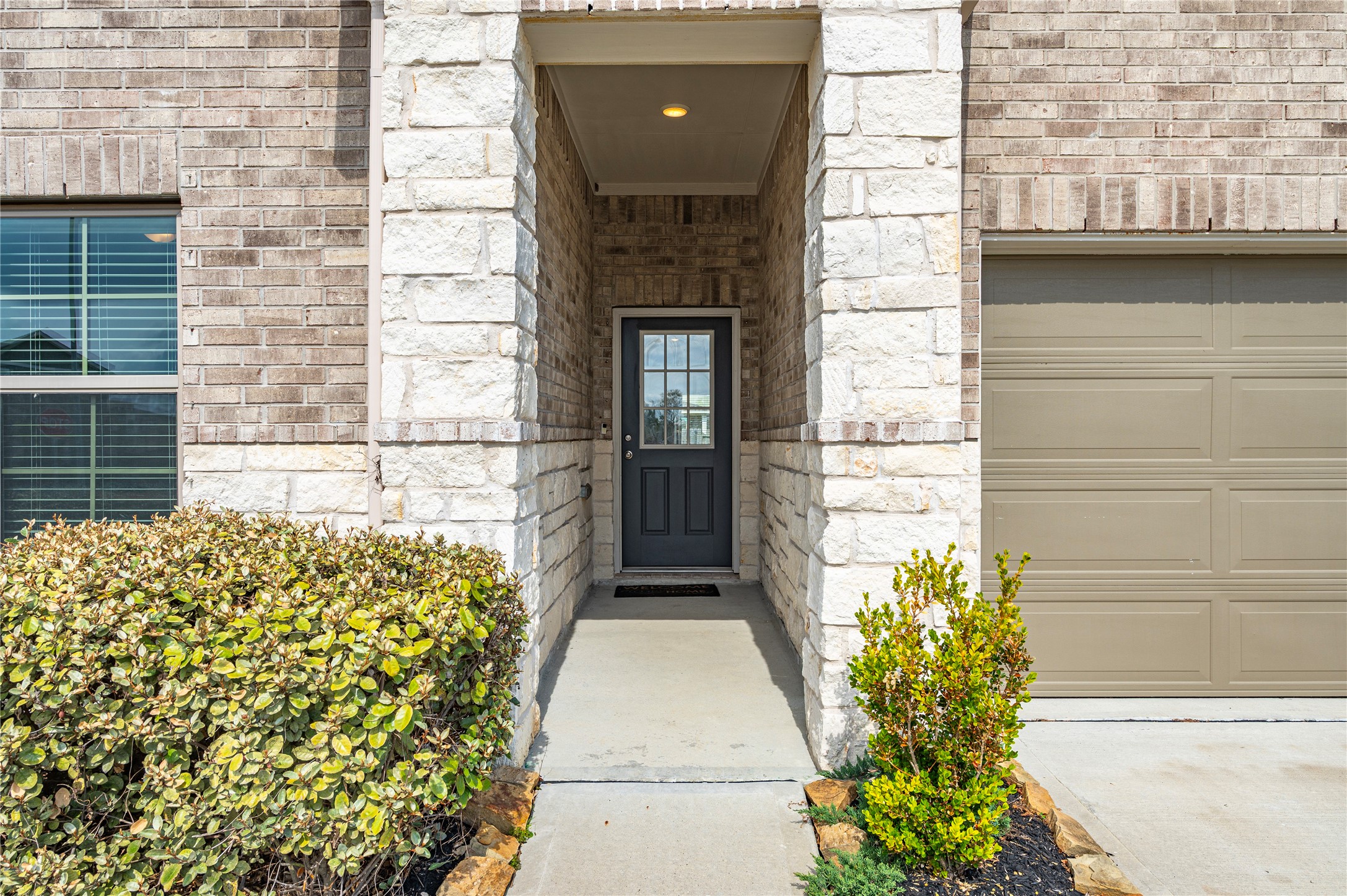 2107 Santa Ana Way Baytown, TX 77523 - Photo 4 of 40 a front view of a house with a garden