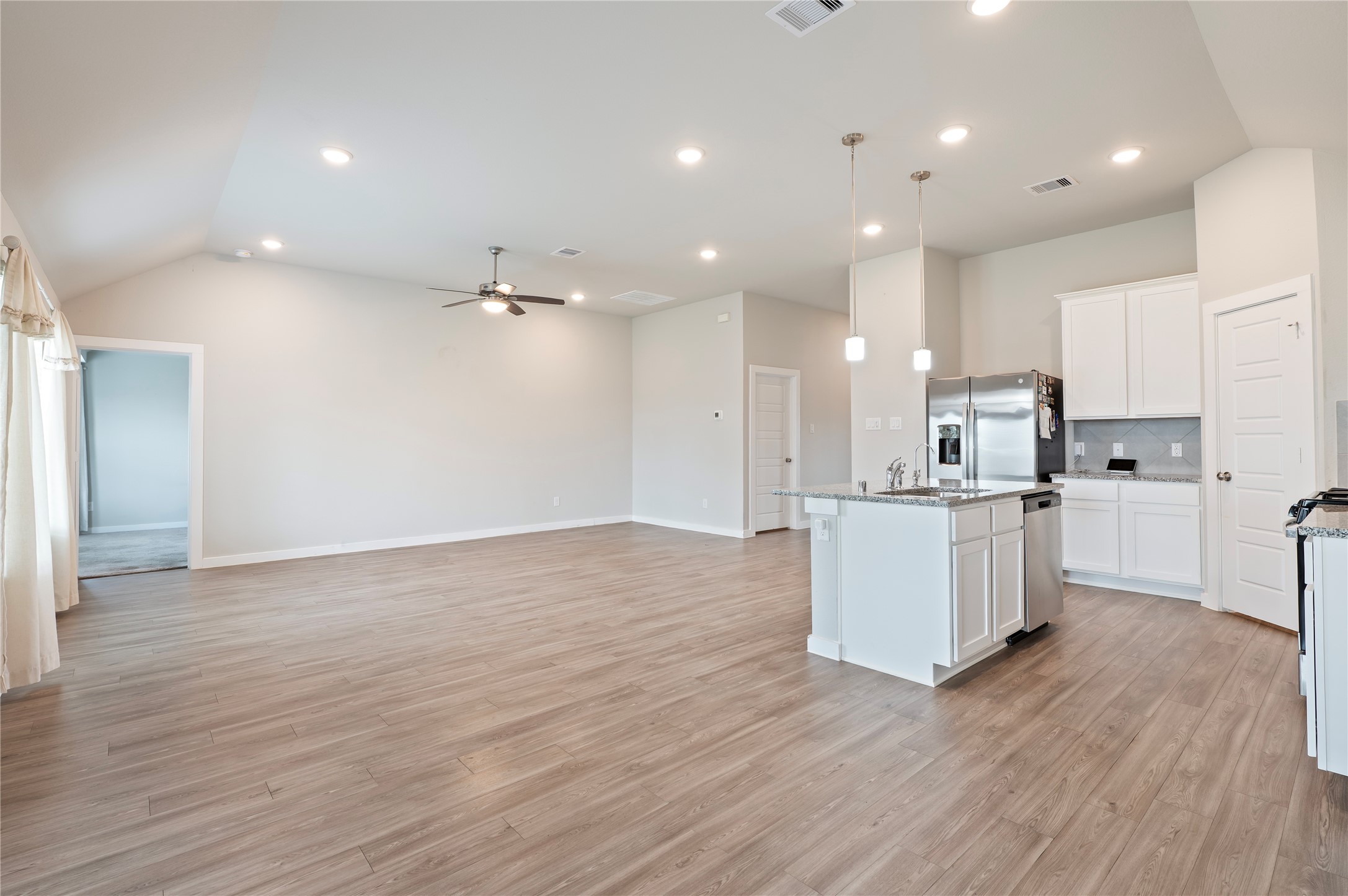 2107 Santa Ana Way Baytown, TX 77523 - Photo 8 of 40 a view of kitchen with kitchen island and stainless steel appliances