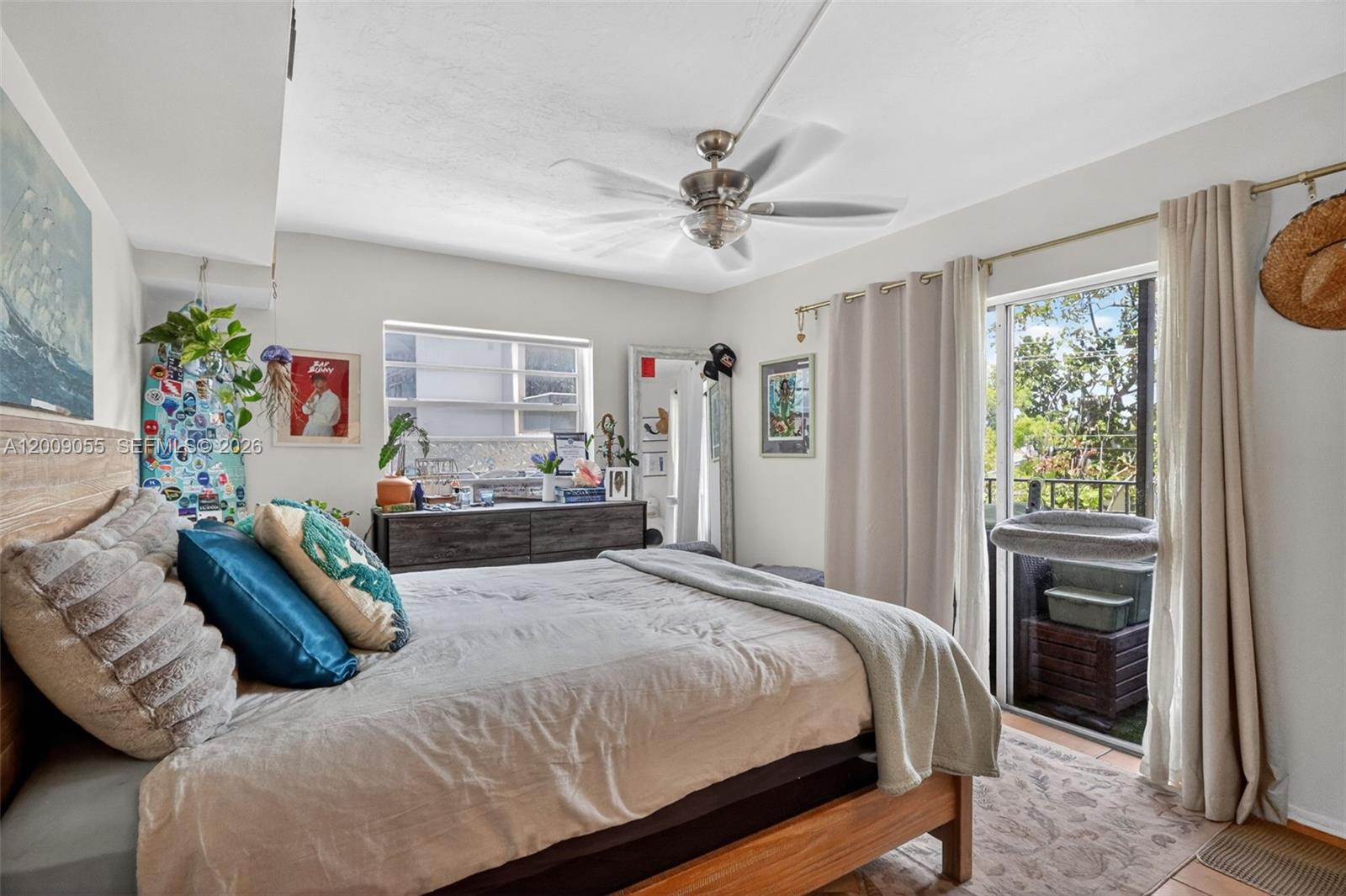 3304 Virginia Street, Unit 3D Miami, FL 33133 - Photo 15 of 19 a bedroom with a bed and a chandelier