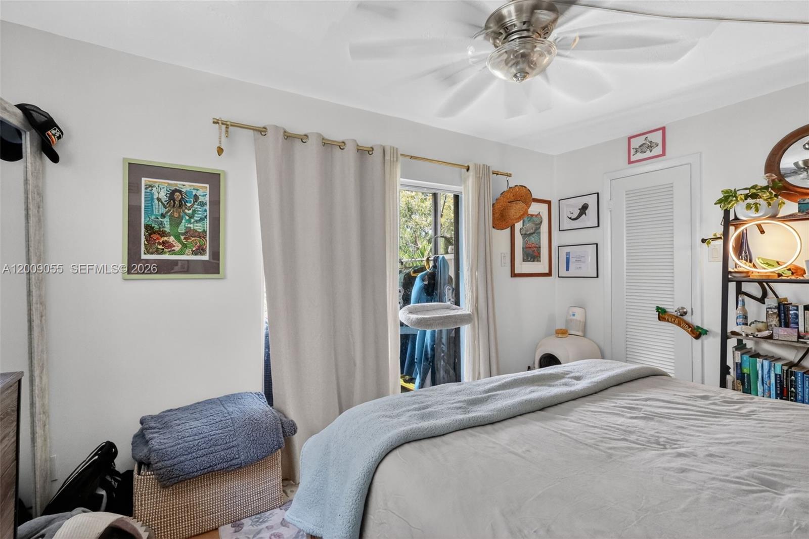 3304 Virginia Street, Unit 3D Miami, FL 33133 - Photo 17 of 19 a bedroom with a bed and a chandelier
