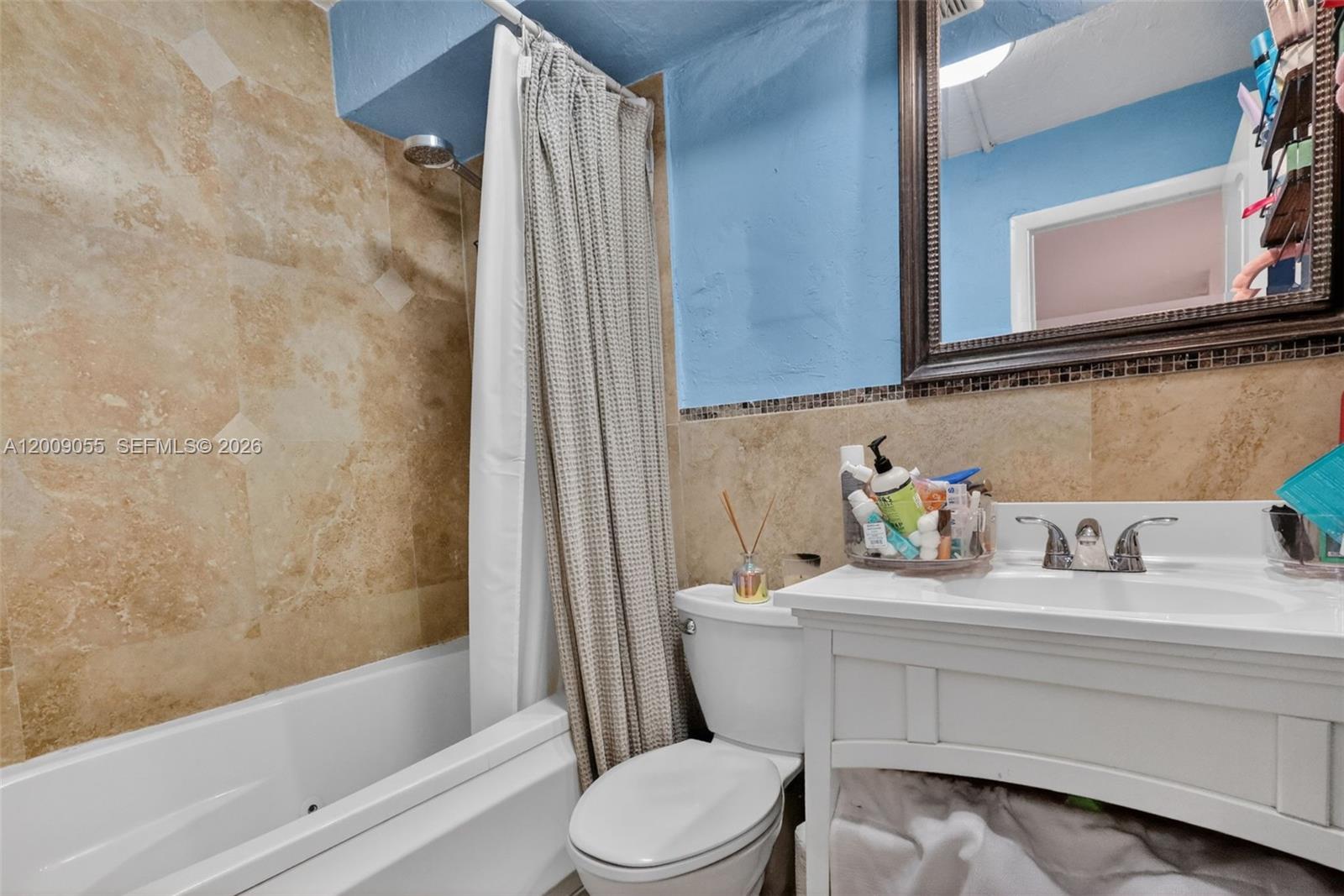 3304 Virginia Street, Unit 3D Miami, FL 33133 - Photo 18 of 19 a bathroom with a sink a toilet and shower