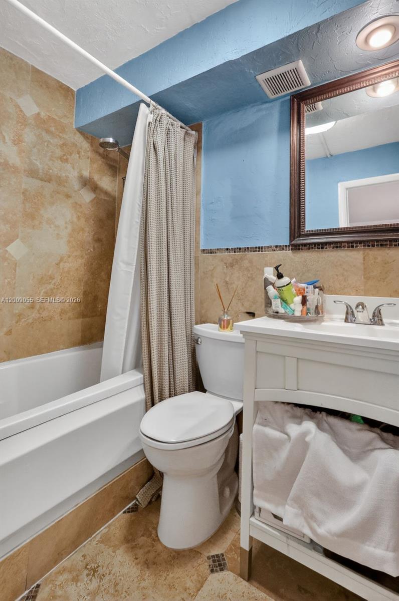 3304 Virginia Street, Unit 3D Miami, FL 33133 - Photo 19 of 19 a bathroom with a sink and a toilet