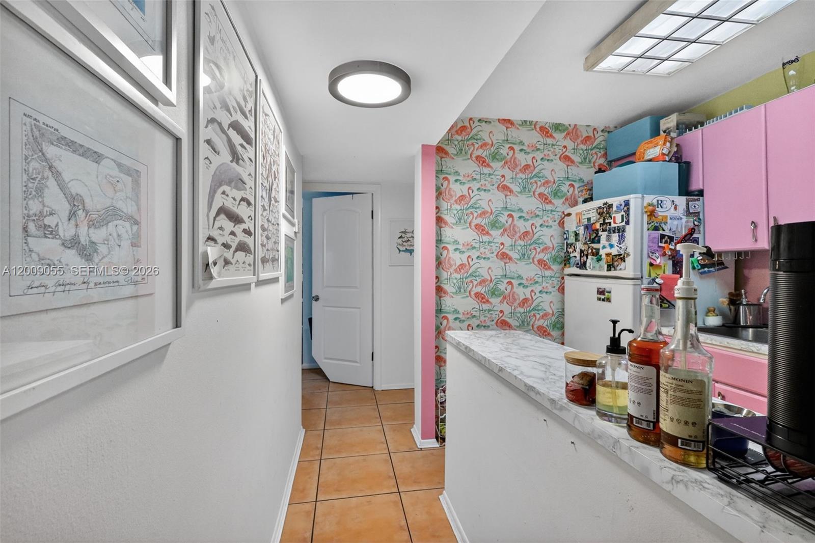 3304 Virginia Street, Unit 3D Miami, FL 33133 - Photo 8 of 19 a kitchen with stainless steel appliances a sink and a refrigerator