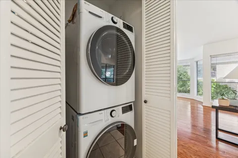 a bathroom with a double vanity sink a mirror and a bathtub