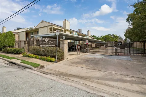 a park with bench and trees