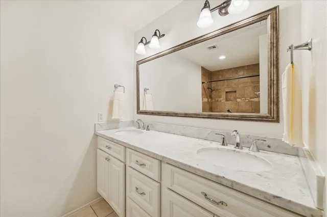 a bedroom with a bed and a table