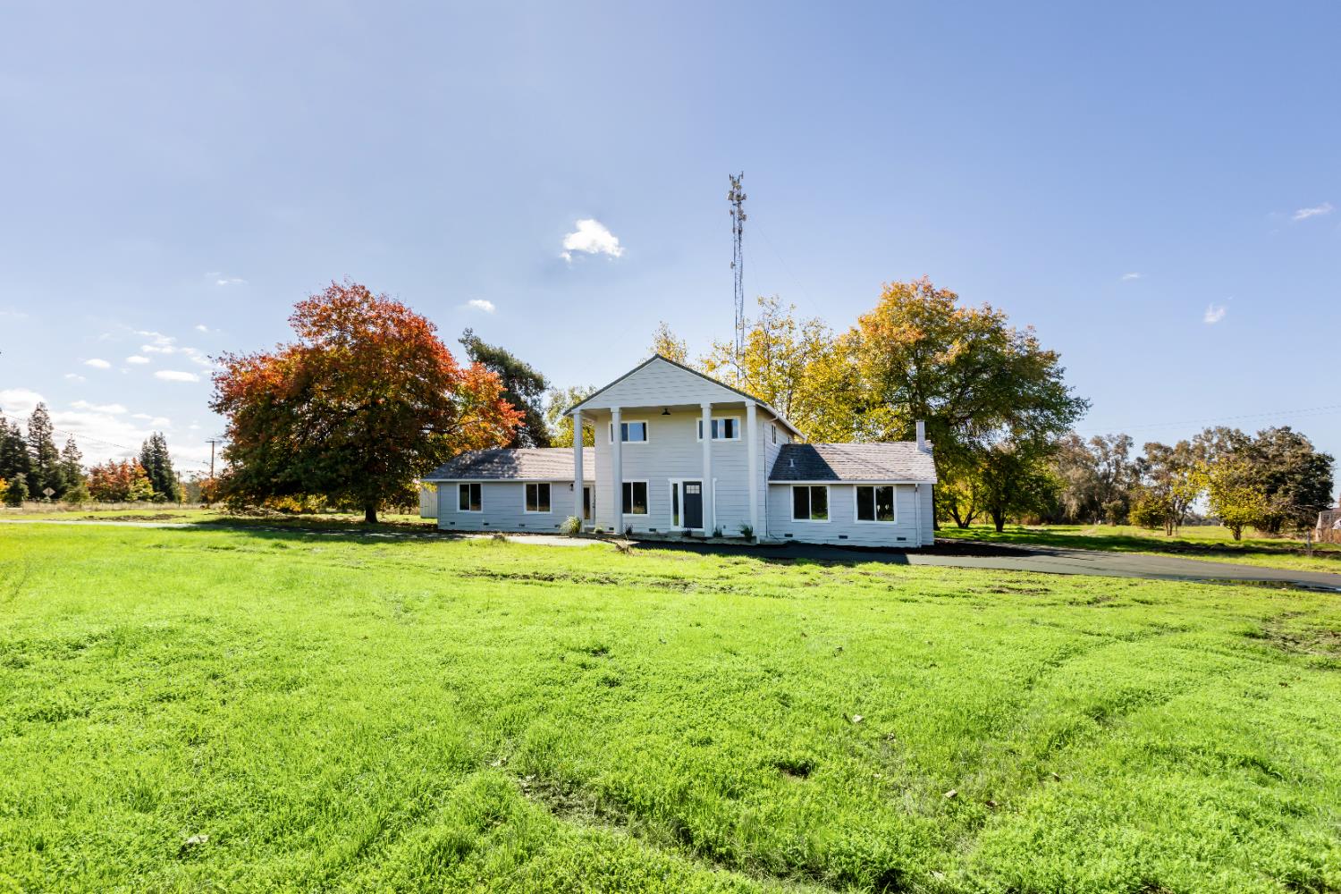 10020 Alta Mesa Road Wilton, CA 95693 - Photo 2 of 56 a front view of a house with a yard and trees