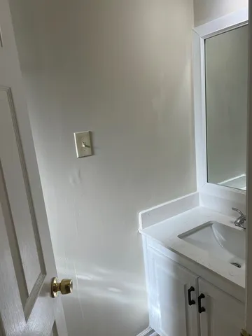 a bathroom with a sink and shower