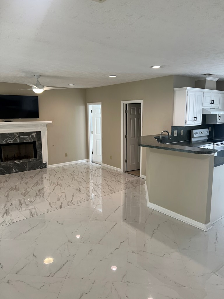6528 Yellow Stone Court Columbus, GA 31909 - Photo 16 of 29 a kitchen with stainless steel appliances granite countertop a stove a sink and a refrigerator