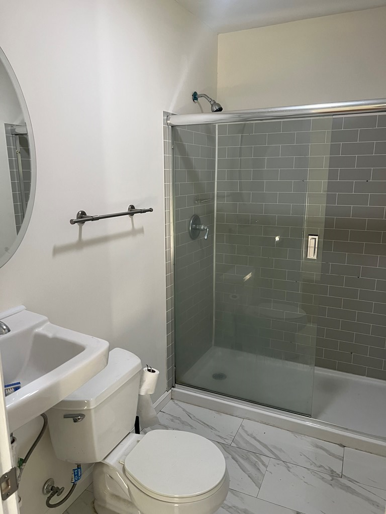 6528 Yellow Stone Court Columbus, GA 31909 - Photo 21 of 29 a bathroom with a toilet and shower