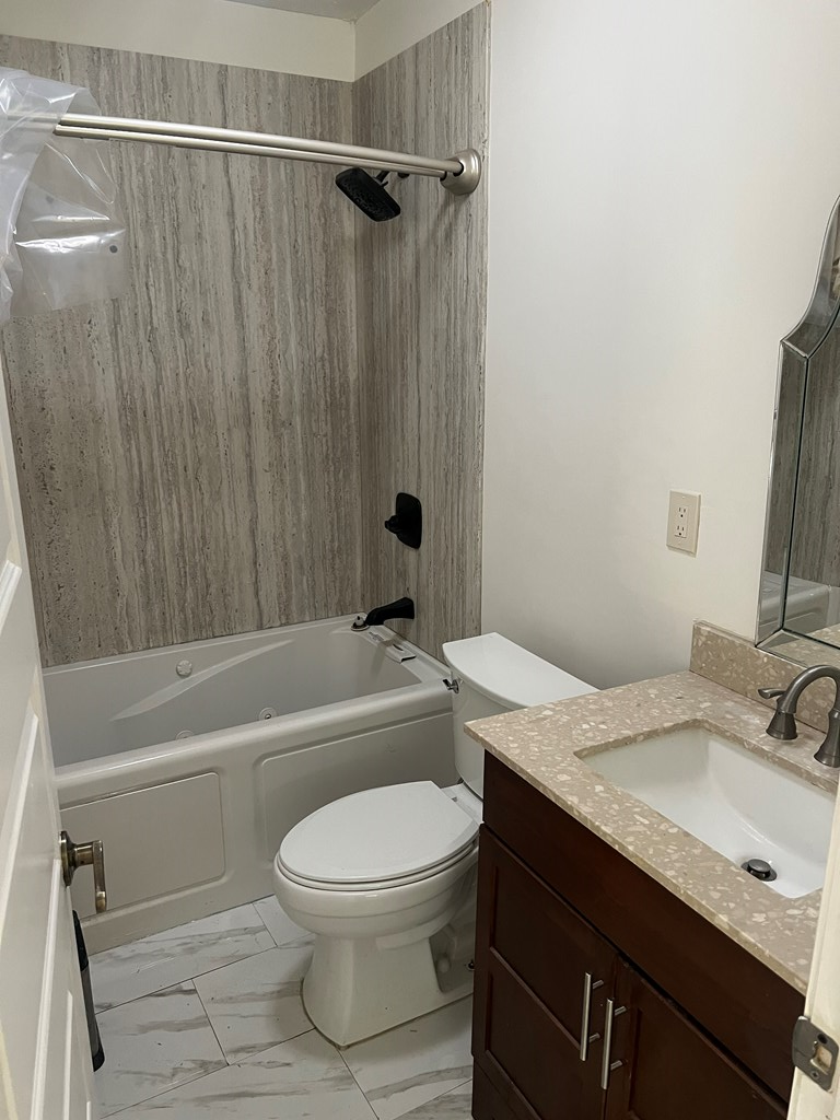 6528 Yellow Stone Court Columbus, GA 31909 - Photo 23 of 29 a bathroom with a granite countertop bathtub shower sink vanity and toilet