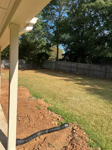 a view of a swimming pool and a yard