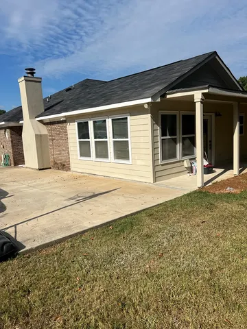 front view of a house with a yard