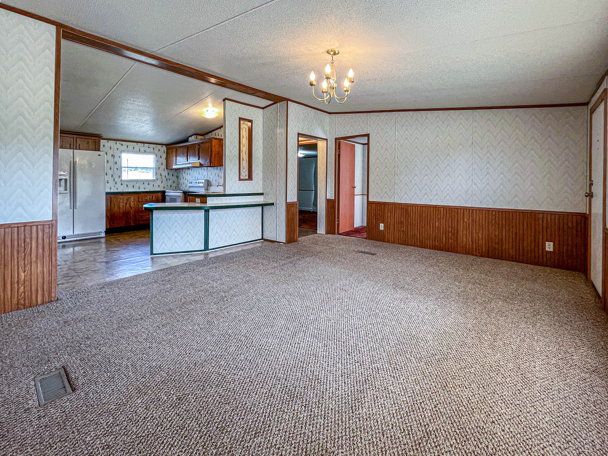 552 Rackley Road Goodspring, TN 38460 - Photo 12 of 26 a view of an empty room and kitchen with a dishwasher cabinets