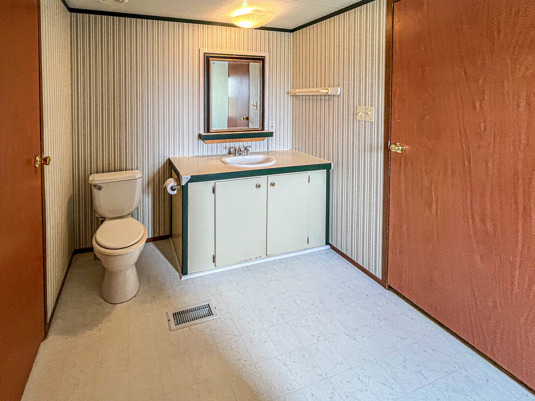 552 Rackley Road Goodspring, TN 38460 - Photo 23 of 26 a bathroom with a granite countertop sink toilet and shower