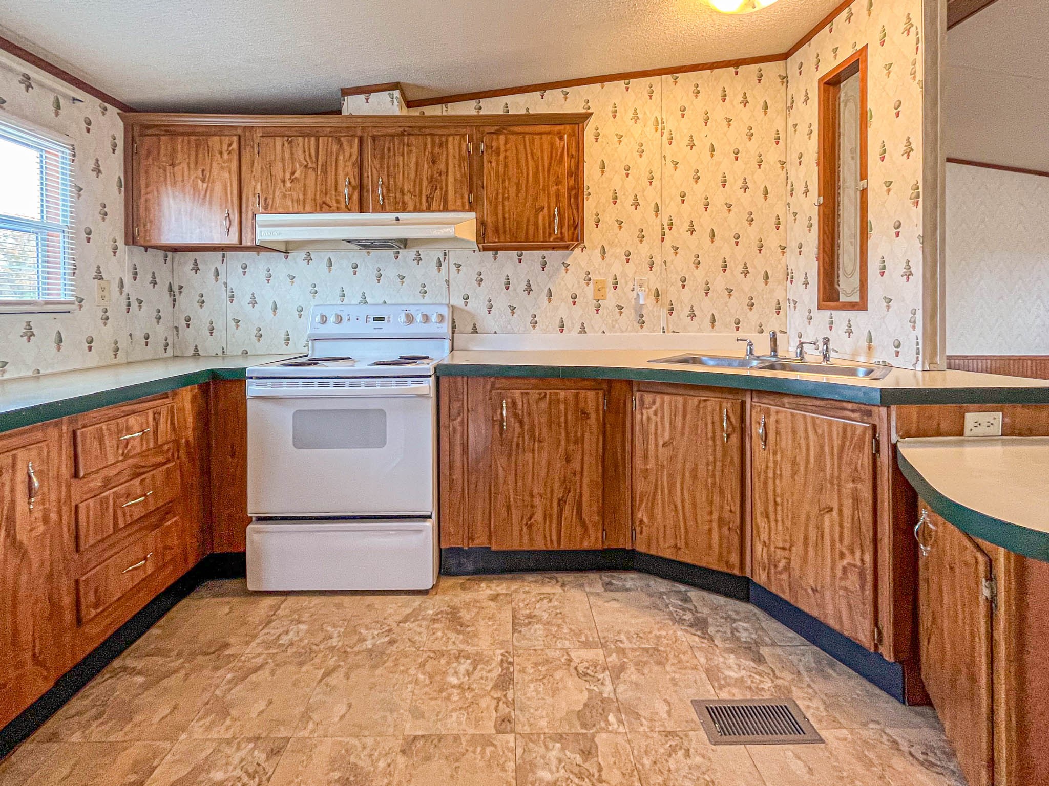 552 Rackley Road Goodspring, TN 38460 - Photo 9 of 26 a kitchen with a stove a sink and a microwave