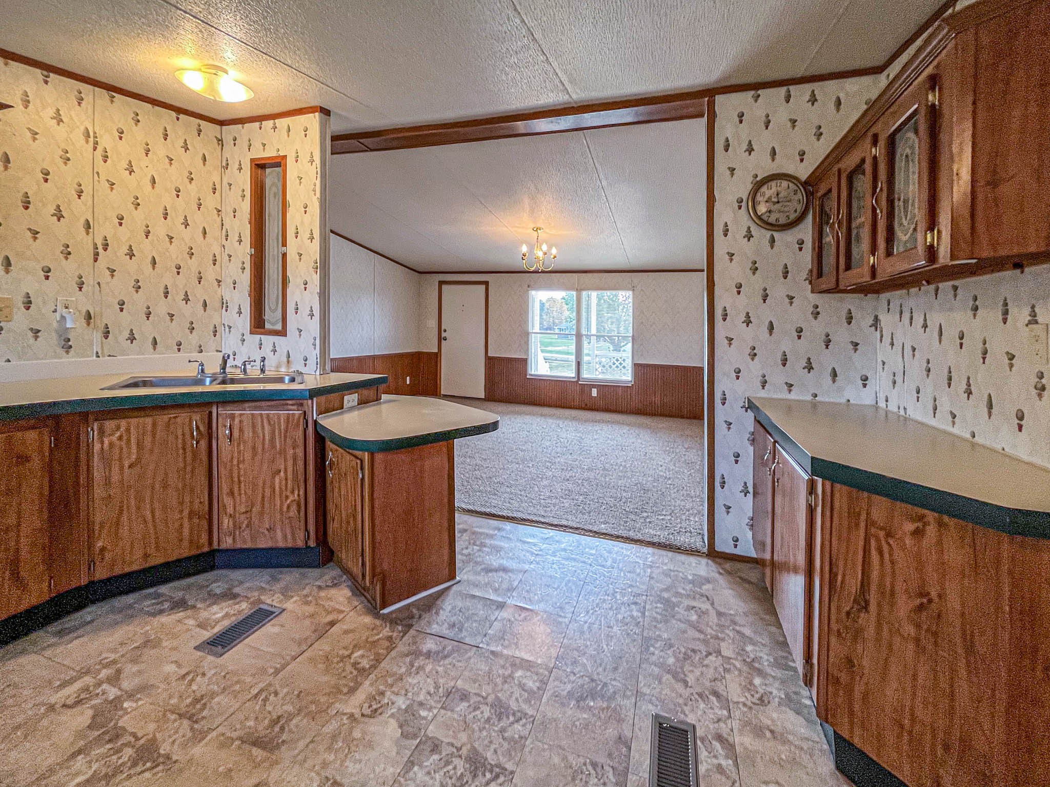552 Rackley Road Goodspring, TN 38460 - Photo 10 of 26 a kitchen with stainless steel appliances granite countertop a stove a sink and a microwave