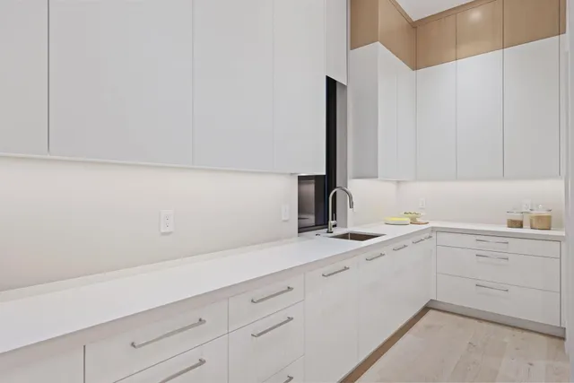 a view of a swimming pool with couches and a table and chairs