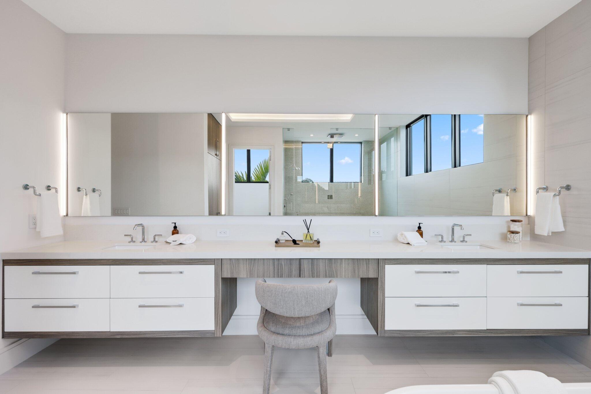 340 Grove Place Delray Beach, FL 33444 - Photo 57 of 95 a bathroom with a double vanity sink and a mirror