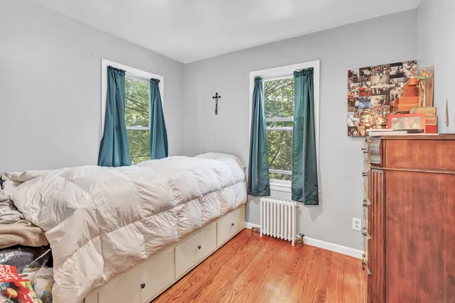 a bedroom with furniture and a book shelf