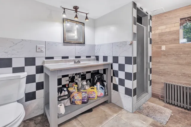 a bath tub sitting in a bathroom next to a window