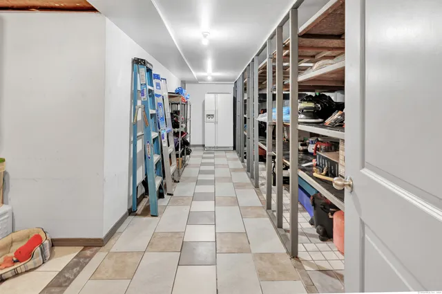 a room with water heater and painted walls