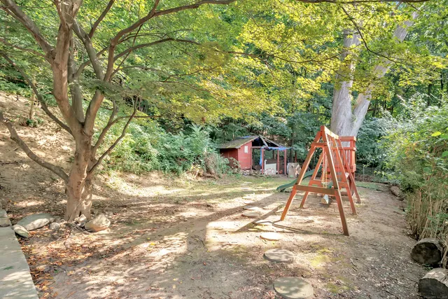 a view of a yard with a slide