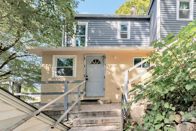 a front view of a house with a yard