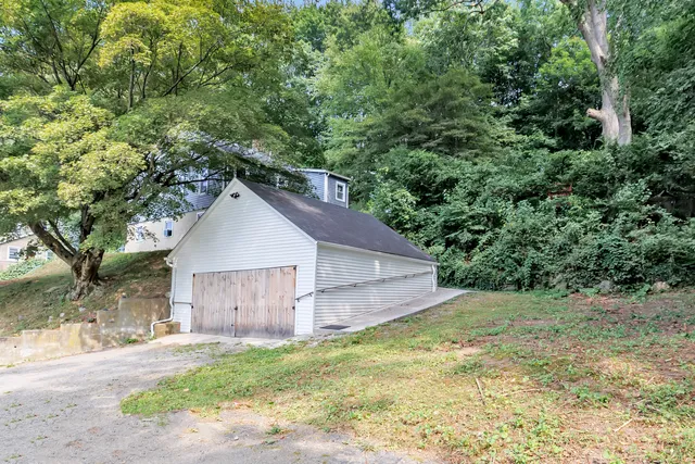 a house with trees in the background